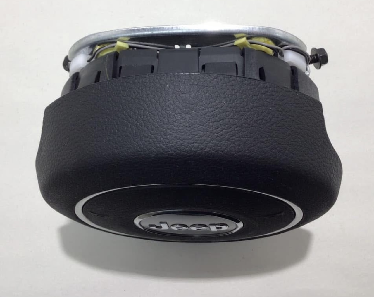 OEM Jeep Wrangler JK steering wheel airbag module.