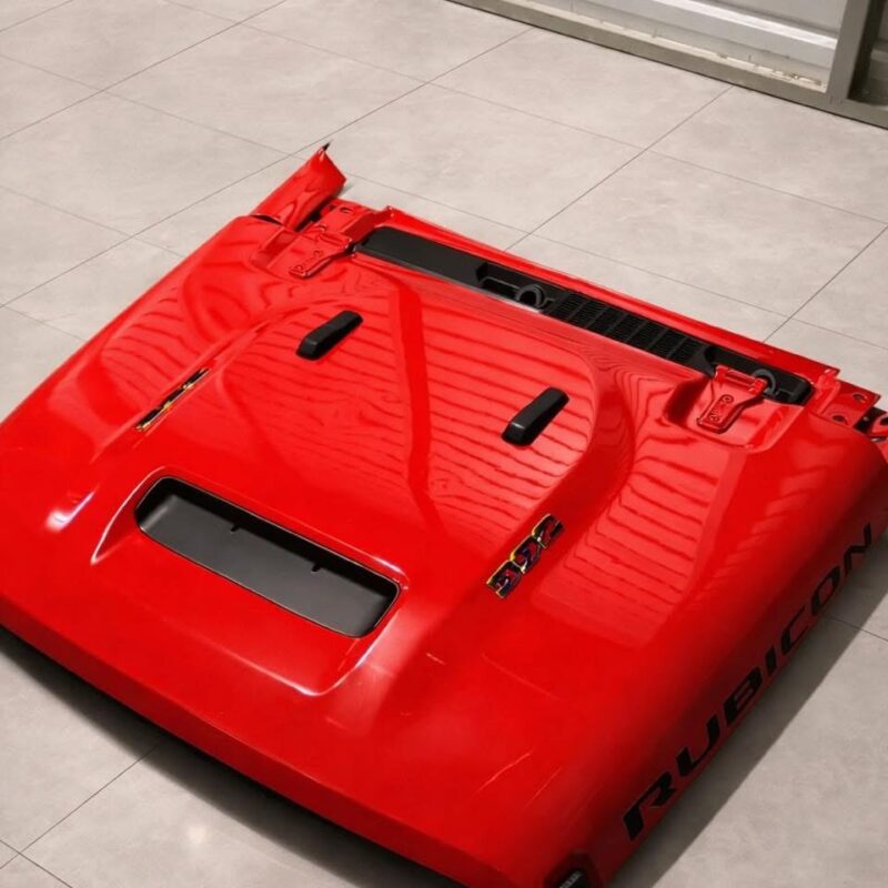 OEM red vented hood for a Jeep Wrangler Rubicon 392.